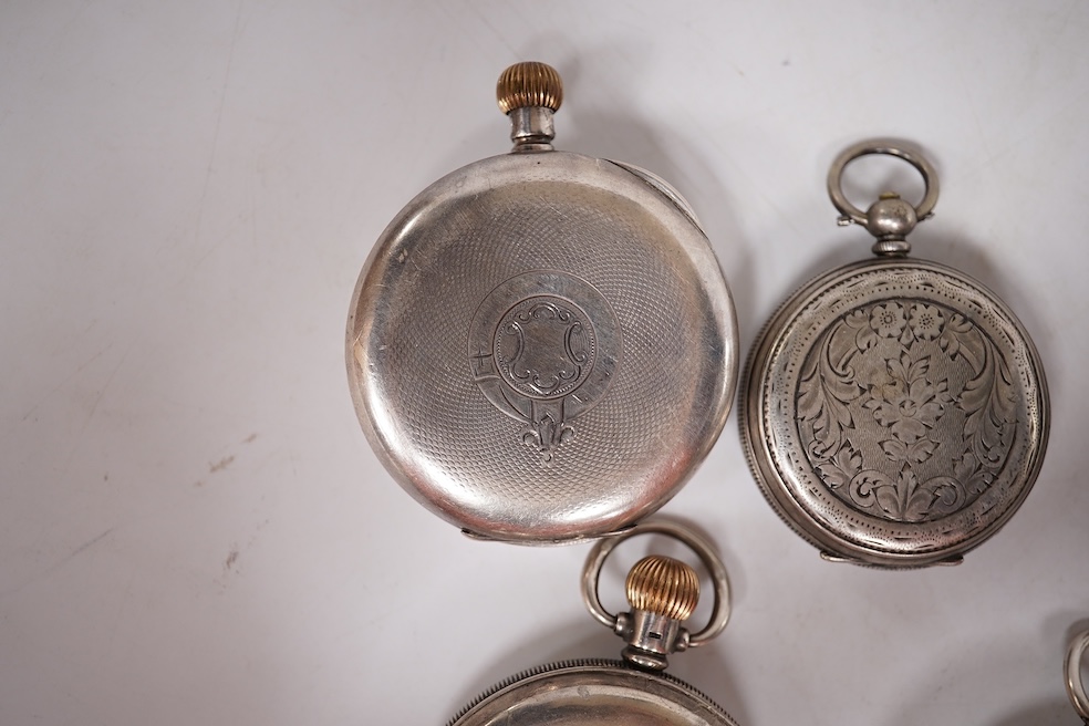 Three early to mid 20th century silver open faced pocket watches, with Roman or Arabic dials and subsidiary seconds, including two keyless and one key wind (Admiral Tacy Watch Co), together with one smaller silver open f